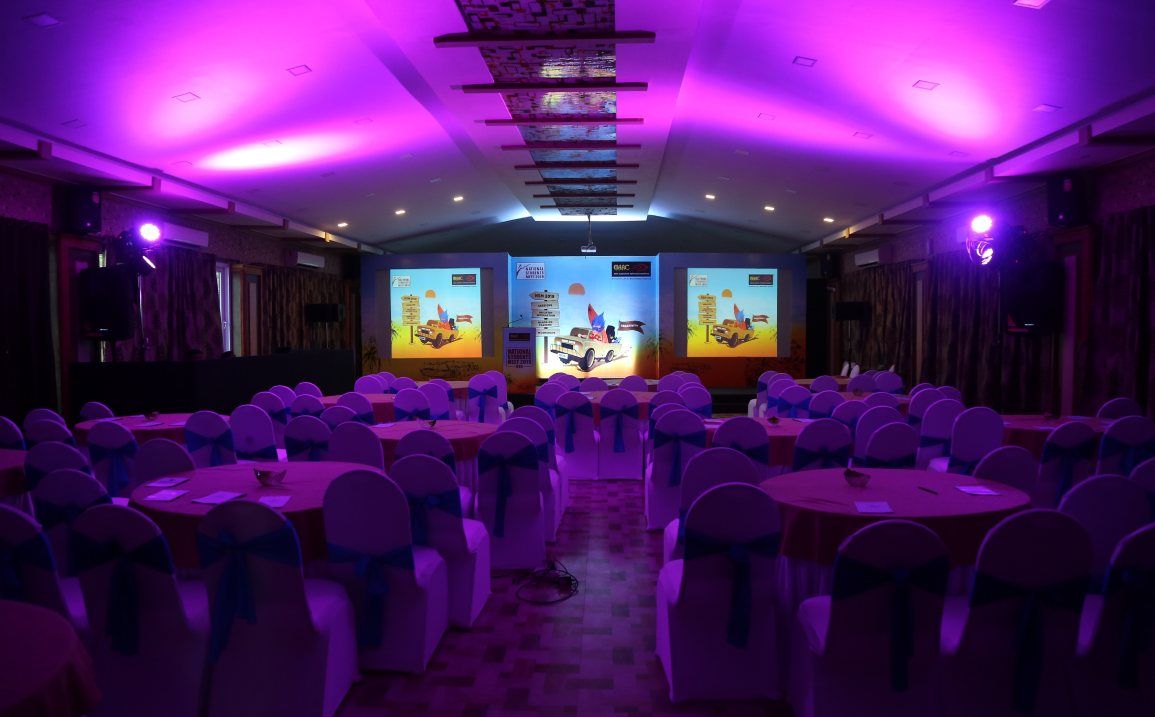 Professional event hall with stylish lighting Modern event venue with projector and lighting